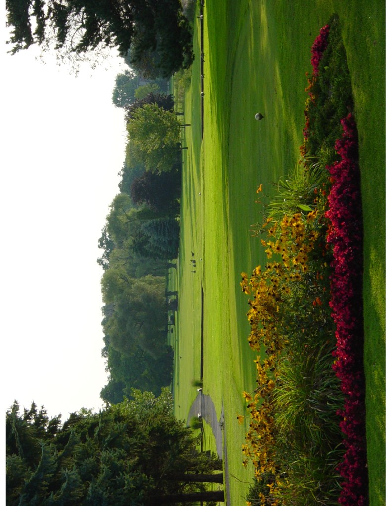 view of first tee with flowers