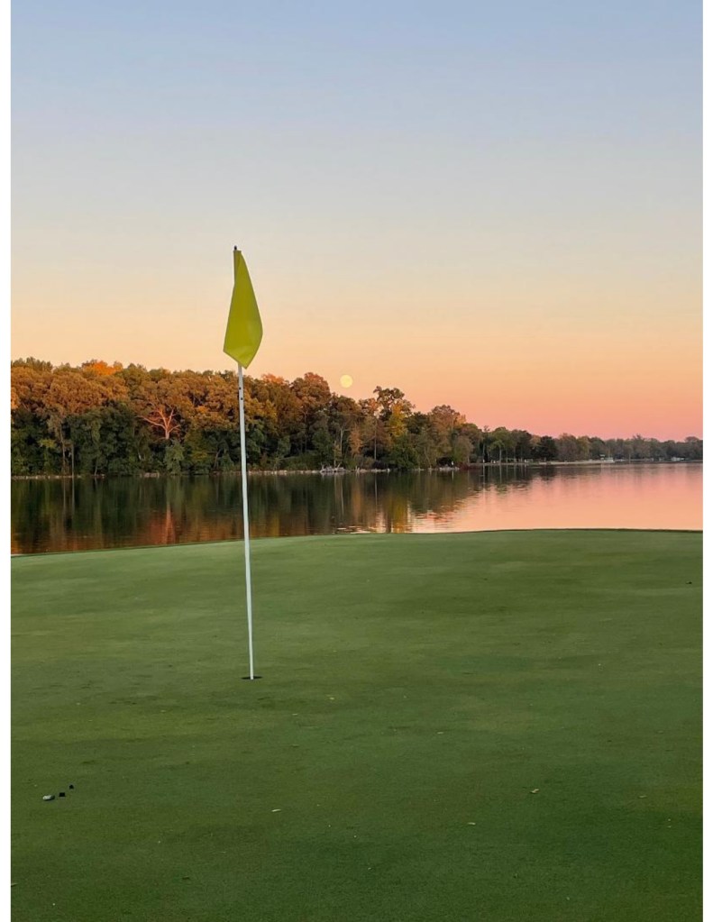 view of the seventh hole at sunset